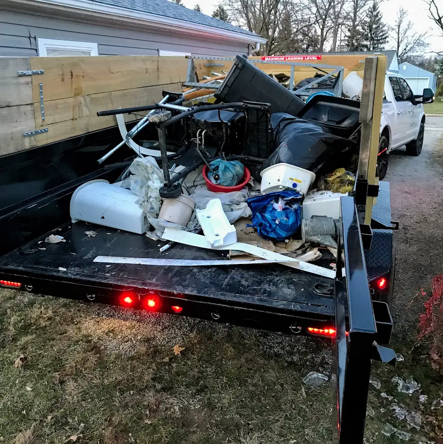 Roll-off dumpster delivered to a residential driveway in Iowa Colony